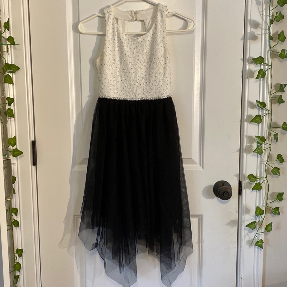 Size ten in girls black and white dress.